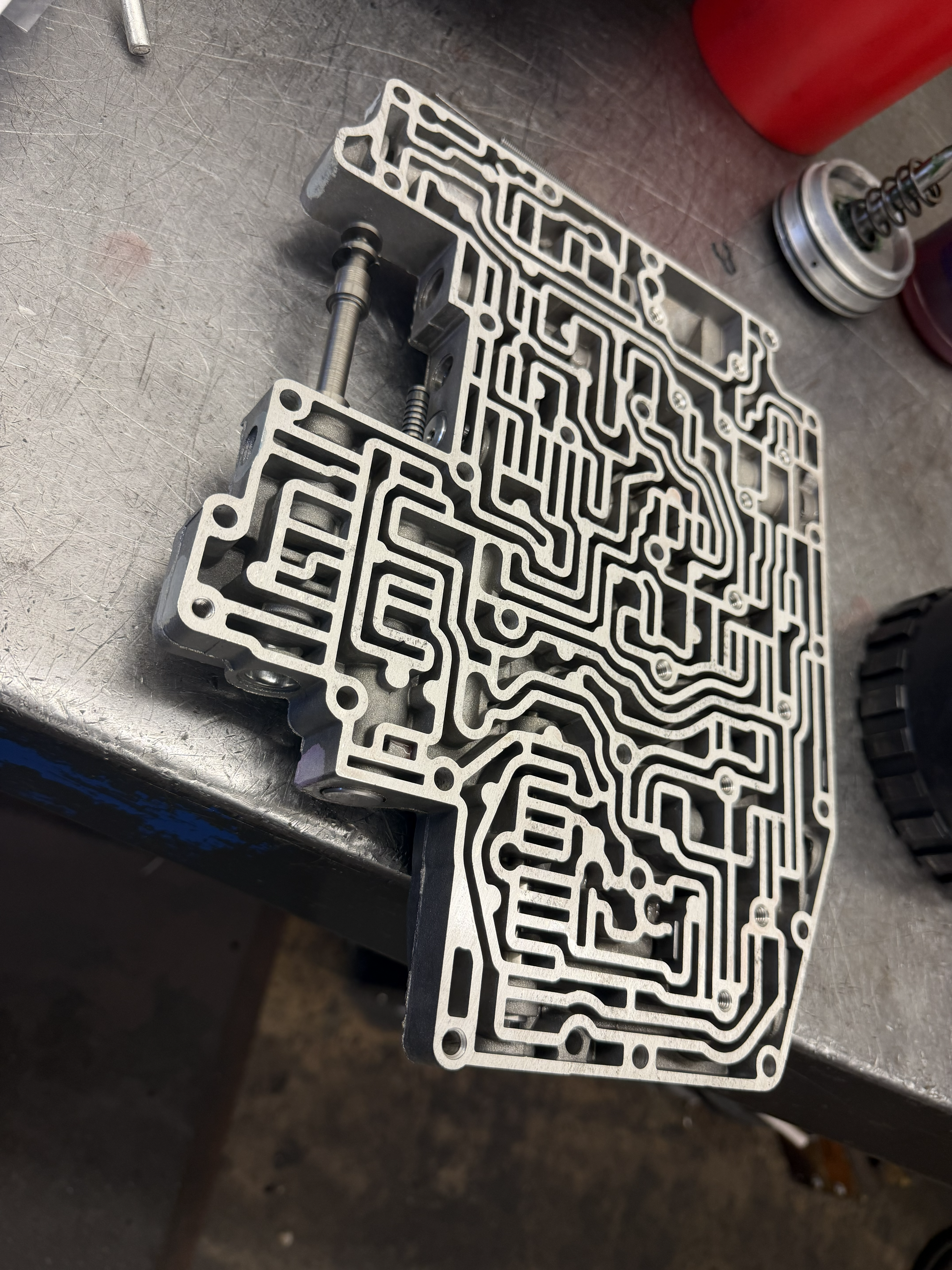 Transmission valve body and fluid service